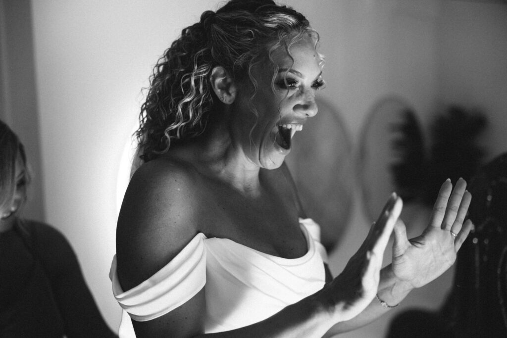 black and white image of bride smiling