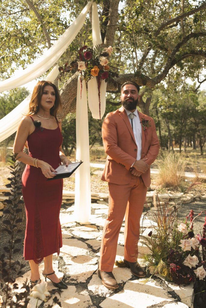 groom tearing up while seeing bride walk down the aisle