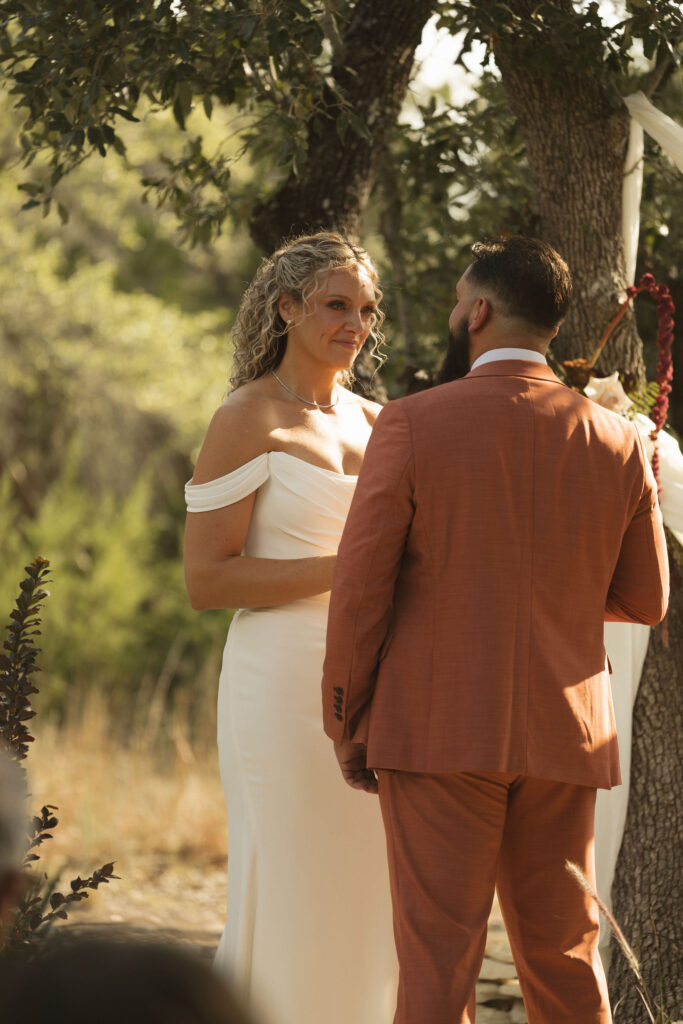 bride smiling at groom