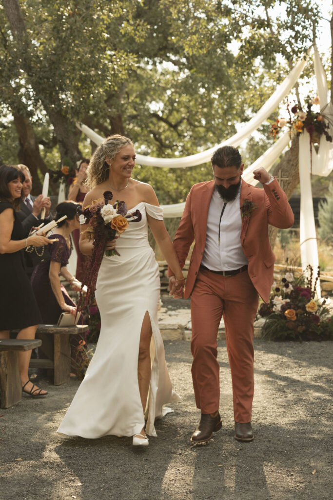 bride and groom exiting wedding